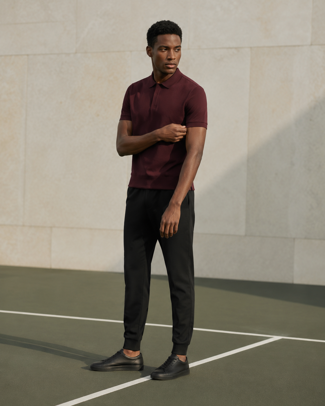 Kalëthon polo and jogger look in an urban court setting